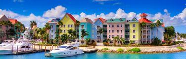 Get travel insurance for the Caribbean to see the colorful houses.