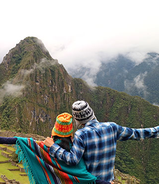 couple looking over machu picchu