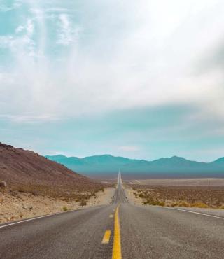photo of a long straight road