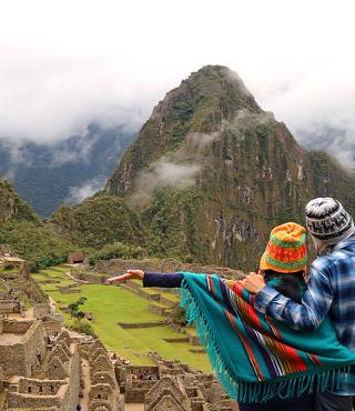 couple looking over machu picchu