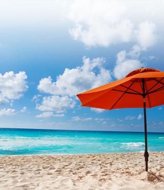 beach chair and umbrella on beach