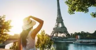 Woman gazing at Eiffel Tower