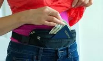 Cash and a passport in a fanny pack