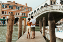 A couple enjoying a trip to Venice, one of the most romantic places in the world.