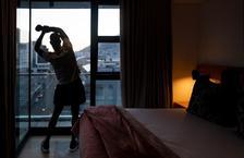 Man stretching in hotel room