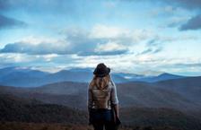 Woman gazing at mountain range