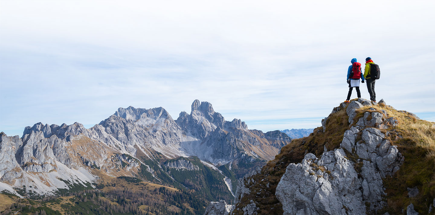 couple looking at scenery from mountaintop