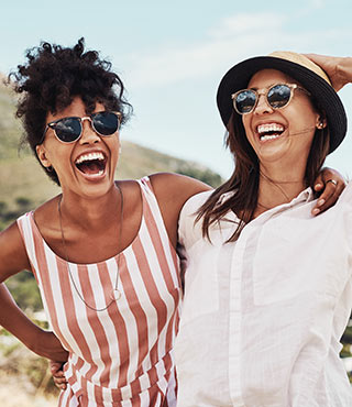 two friends laughing near mountain