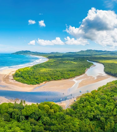 Aerial view of Tamarindo Beach highlighting travel insurance for Costa Rica