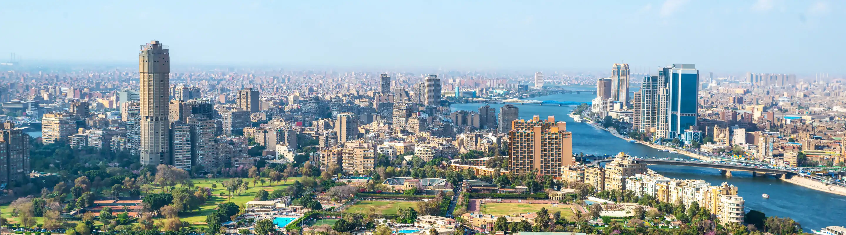 an aerial view of downtown Cairo and the Nile River, a place people visit with travel insurance for Egypt