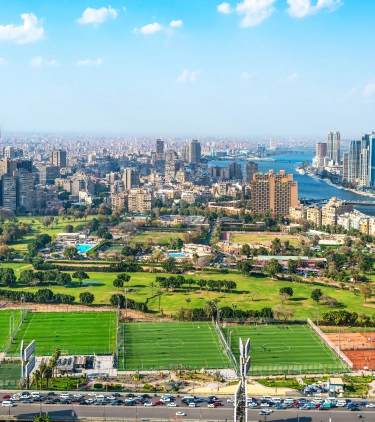 an aerial view of downtown Cairo and the Nile River, a place people visit with travel insurance for Egypt
