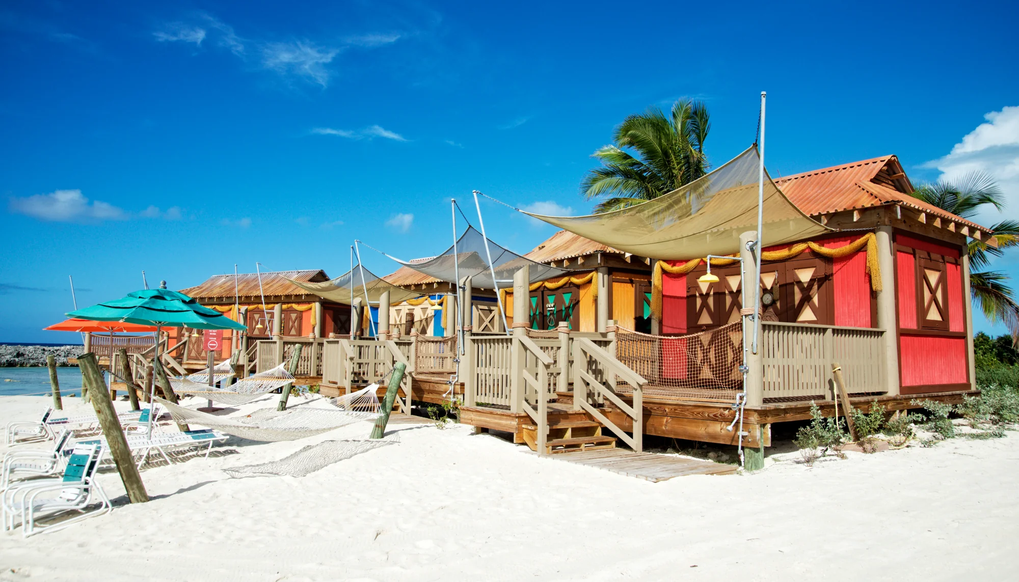 colorful cabanas on the beach in the Bahamas during the Caribbean hurricane season