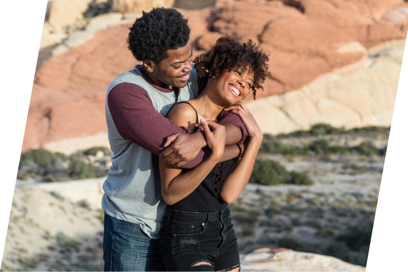 a couple embracing in the desert on vacation, insured with travel insurance for Nevada