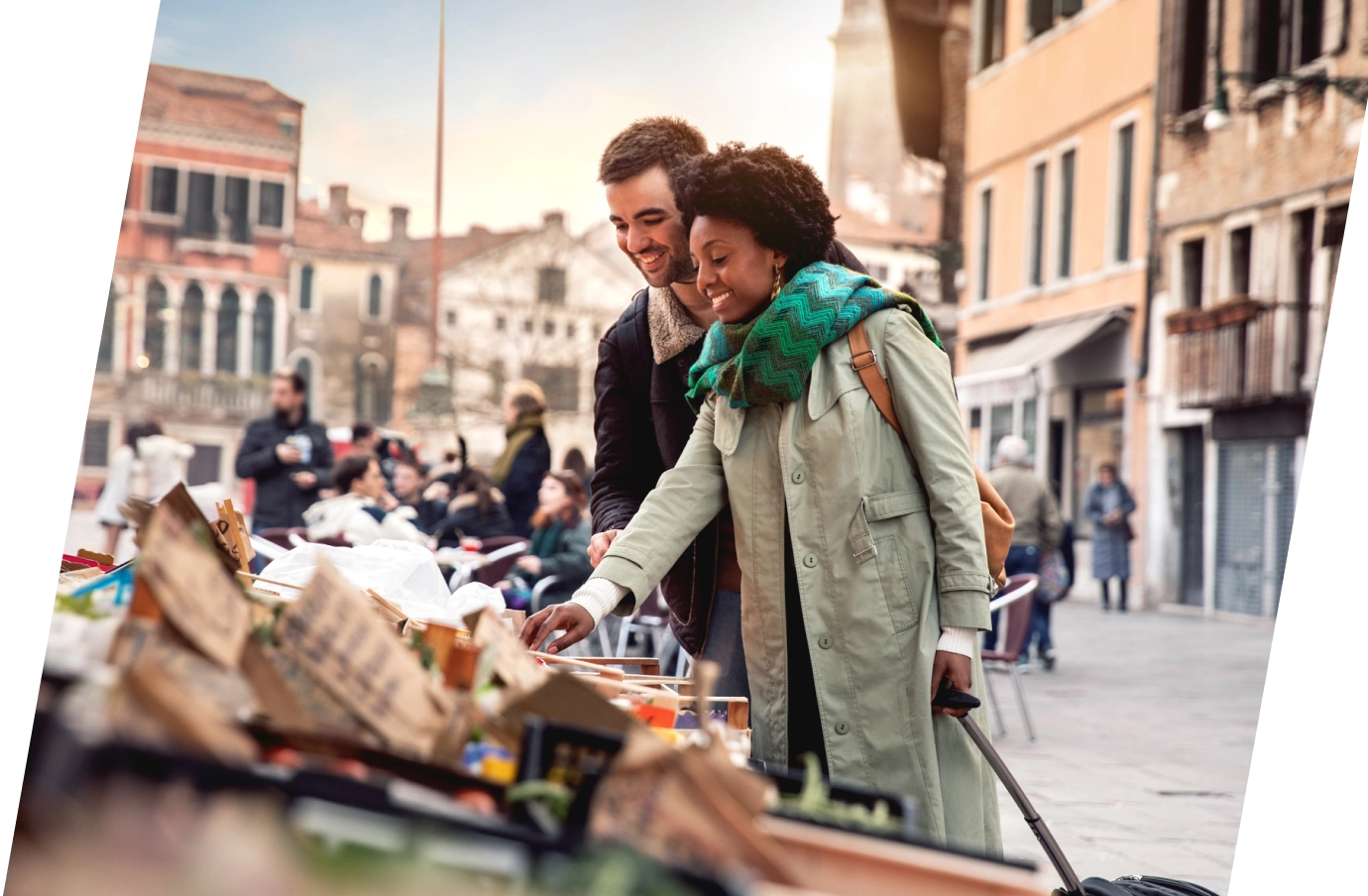 a couple with travel insurance for Europe, shopping at a local market in a European town