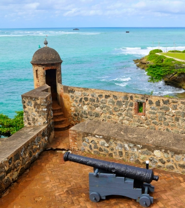 View of Fort San Filipe with the ocean in the background for travel insurance for Dominican Republic trips