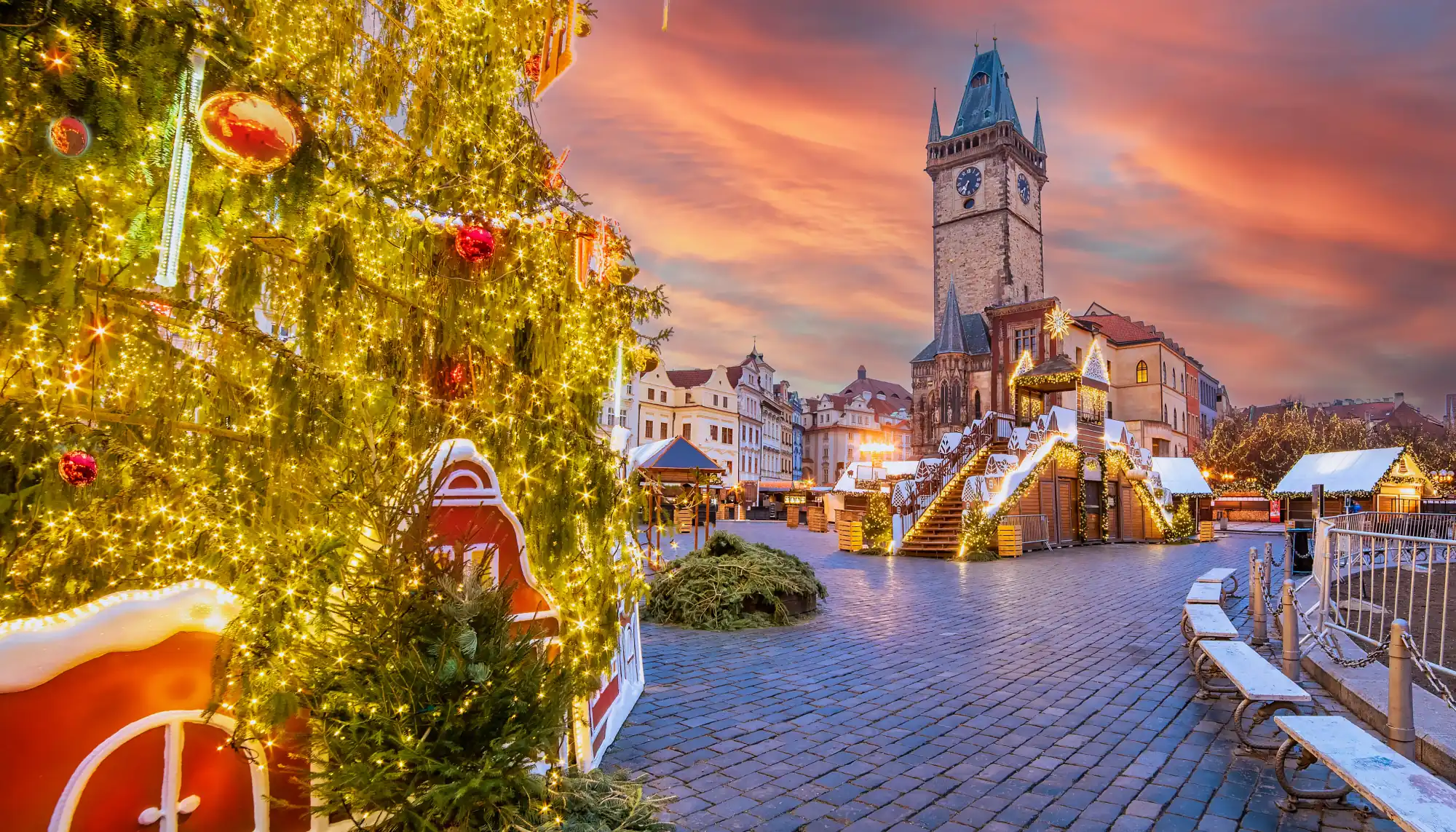 a Christmas tree and holiday decorations in a historic European town at dusk, highlighting the charm of Christmas in Europe