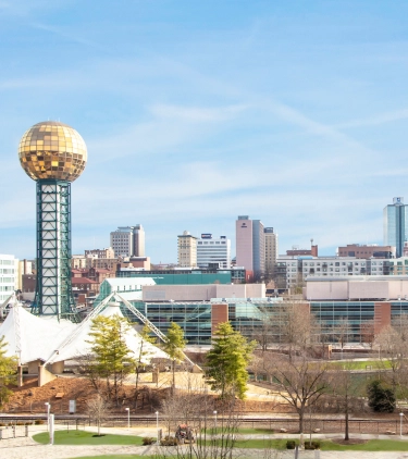 Panoramic view of the Knoxville skyline, highlighting travel insurance for Tennessee