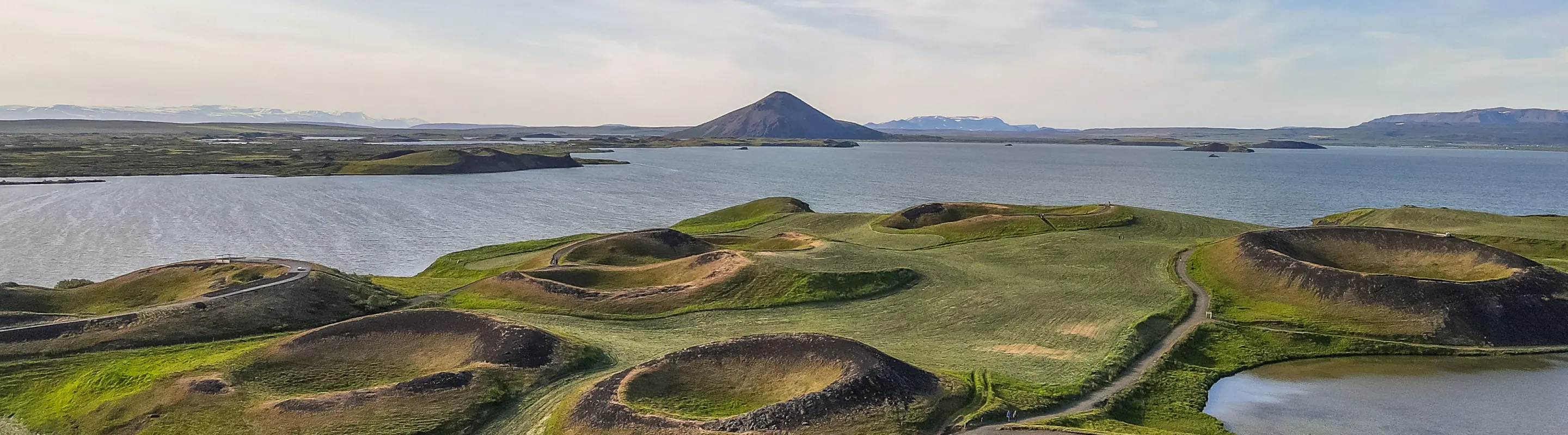 A view of Lake Myvatn in Northern Iceland, highlighting its ruggedness and the need for travel insurance for Iceland 