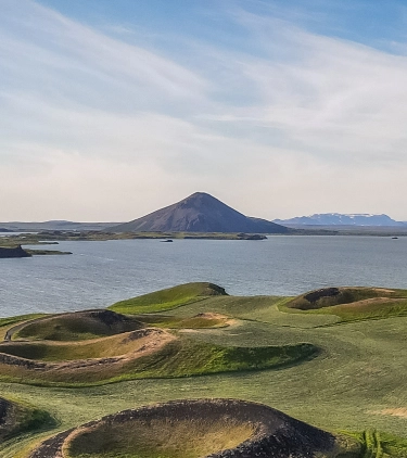 A view of Lake Myvatn in Northern Iceland, highlighting its ruggedness and the need for travel insurance for Iceland 