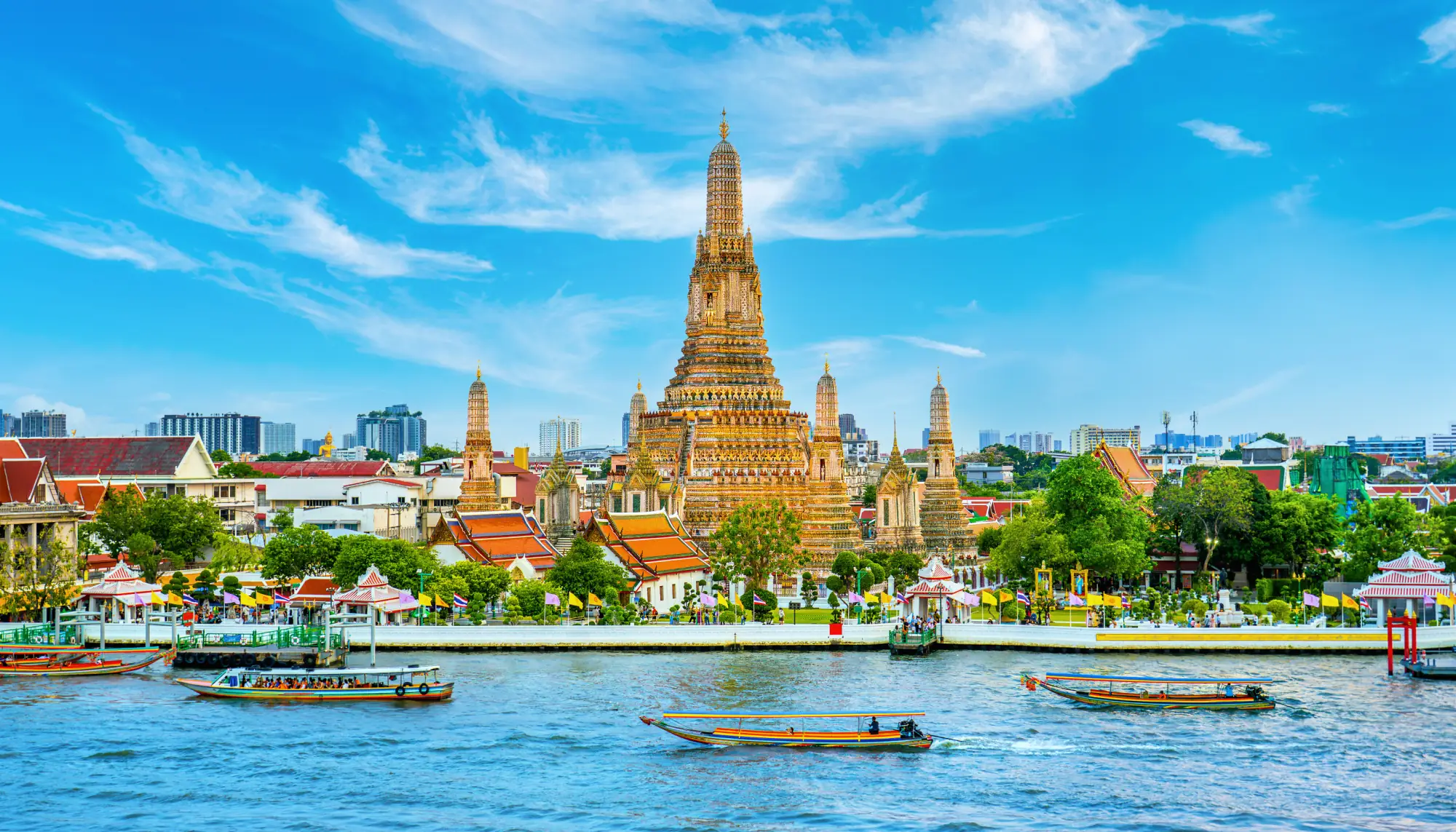 View of the city of Bangkok and Wat Arun Ratchawararam, a top destination for travelers to use a travel app for safer travels