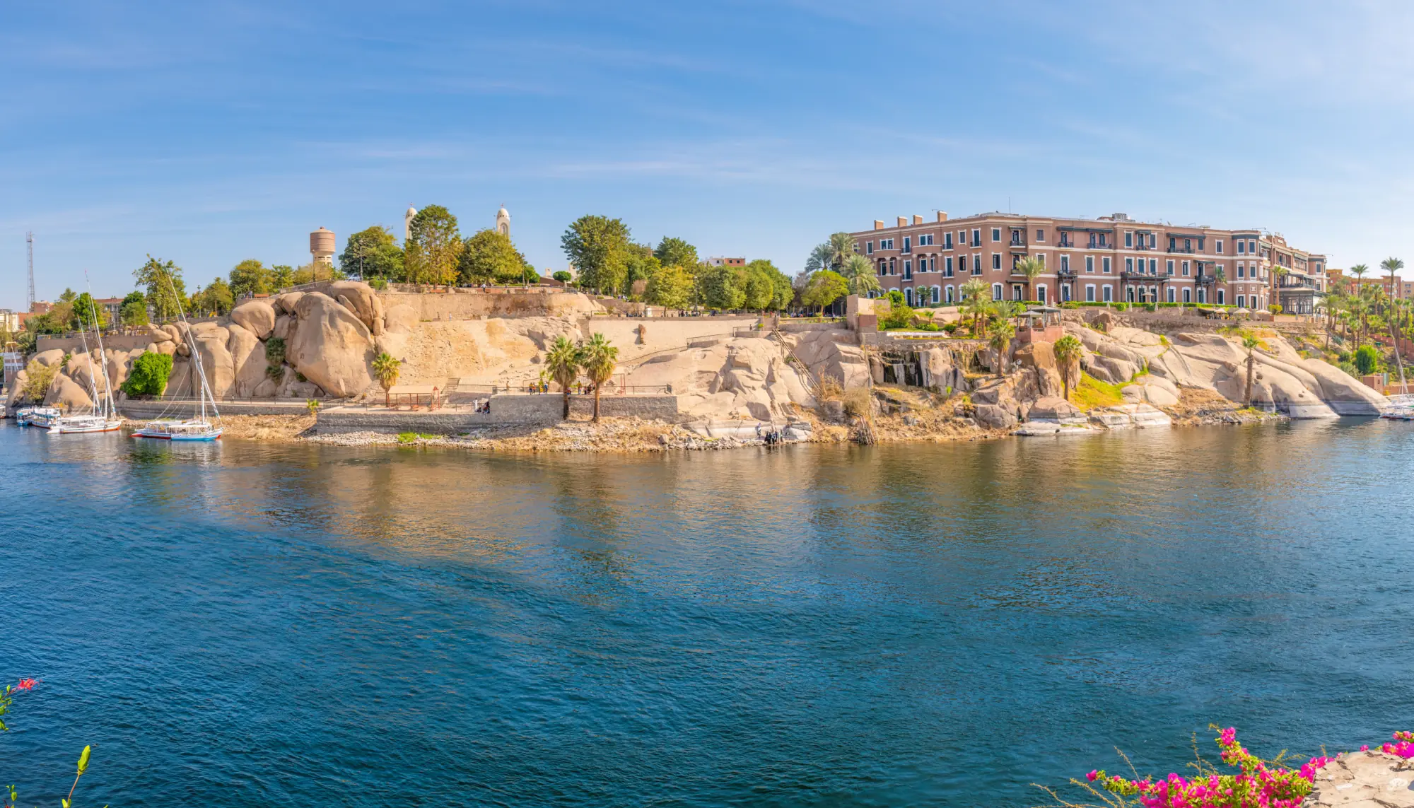 a view of a rocky shoreline in Aswan, Egypt, where people who want to visit sometimes ask, "is travel insurance worth it?"