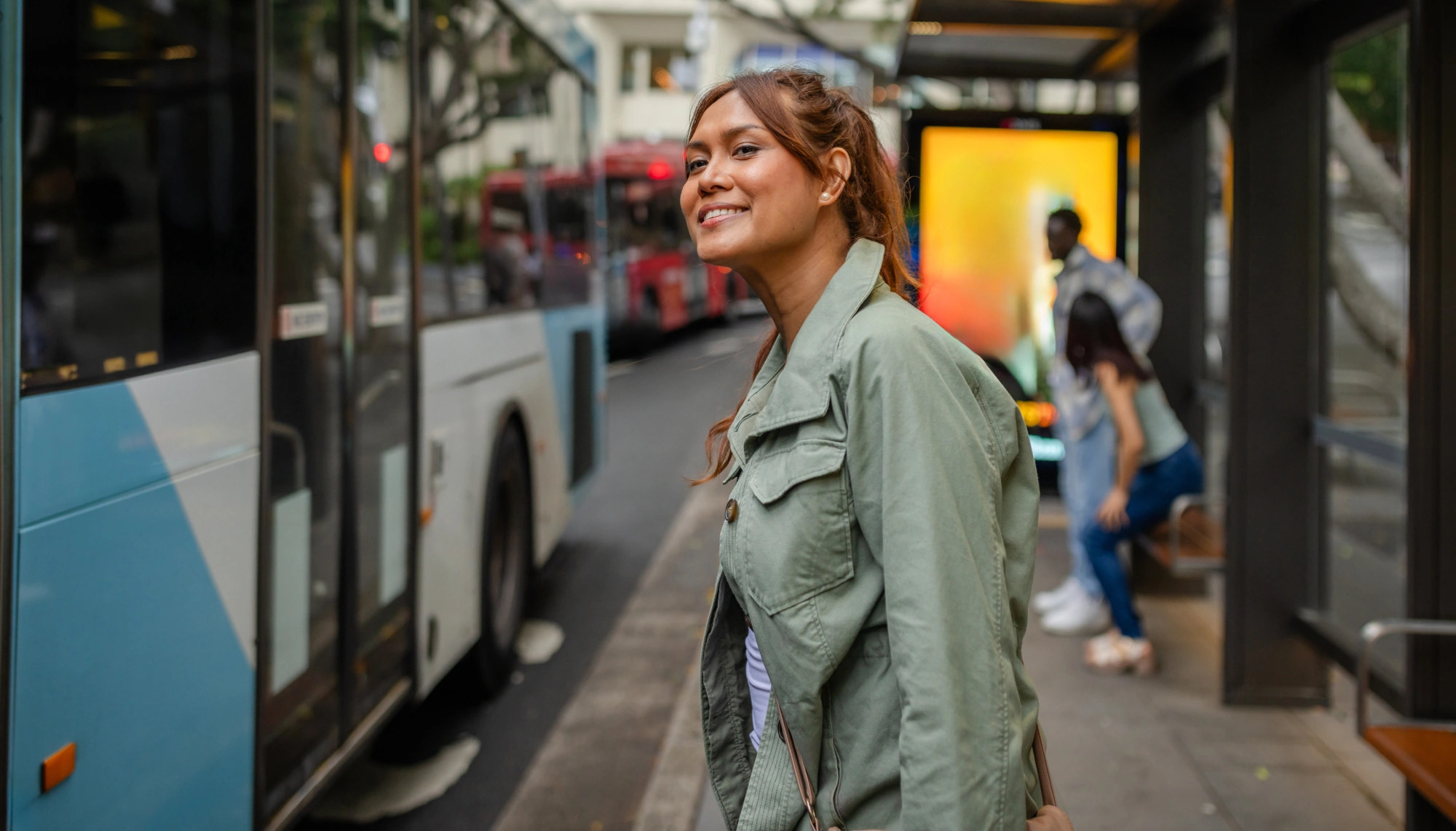 a woman confidently catching the bus abroad after reading a guide with female solo travel tips 