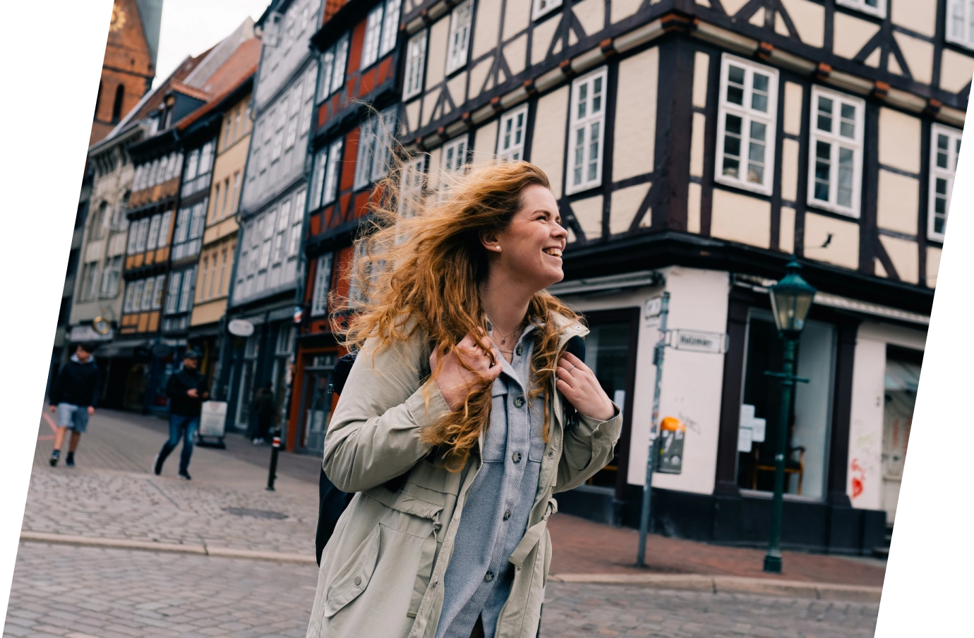 Young woman with travel insurance for Germany sightseeing in the traditional town of Hanover