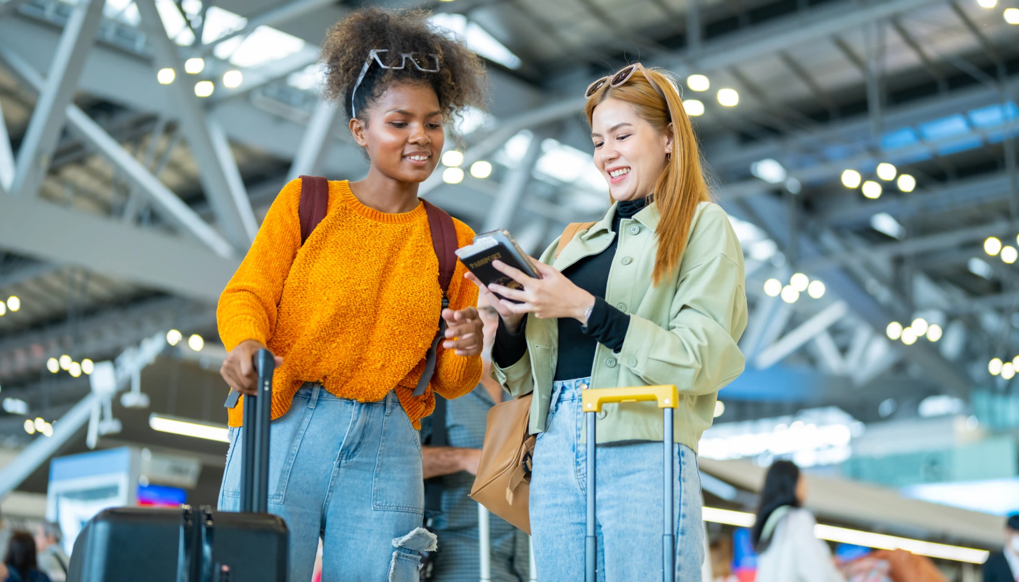 two women in the airport keep their documents in hand so that they don't lose their passports on vacation