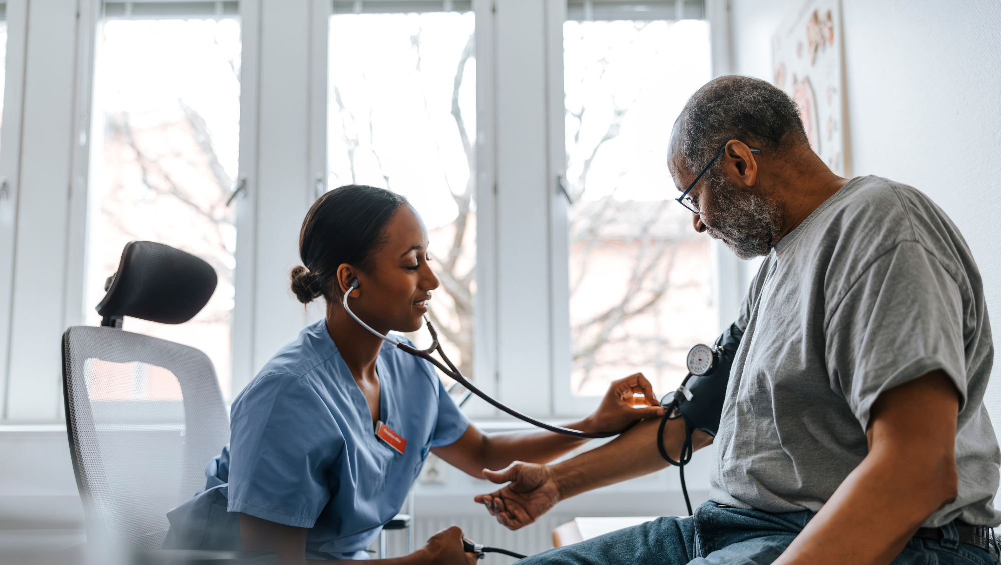 a patient sees a doctor on vacation to get his blood pressure and heart checked