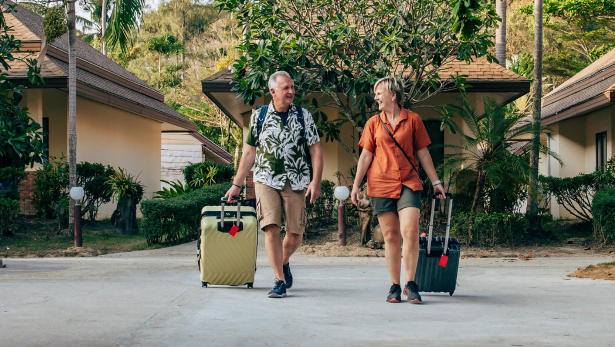 a couple checks into their Thai resort, keeping their travel app on hand in case they need help