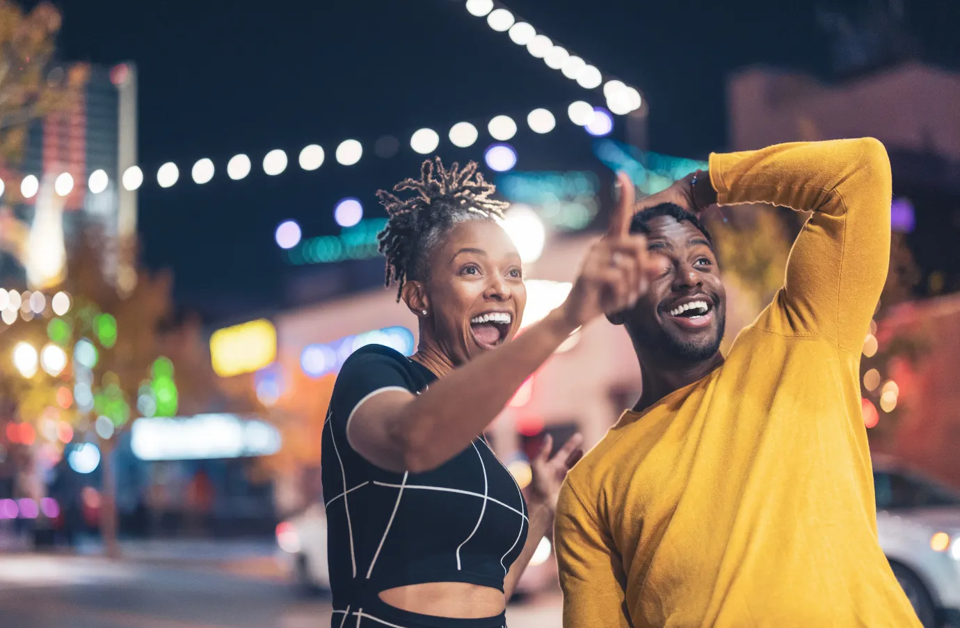 a young couple explore Las Vegas at night, insured with travel insurance for Las Vegas 