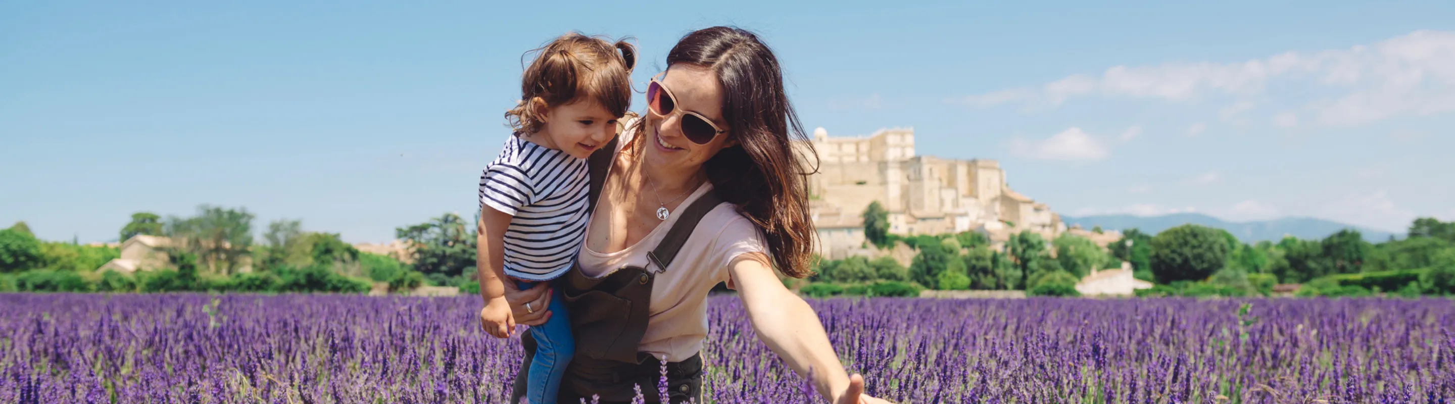 mother and daughter with travel insurance for France, enjoying lavender fields in Provence  