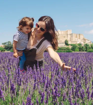 mother and daughter with travel insurance for France, enjoying lavender fields in Provence  
