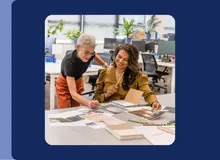 two business professionals reviewing marketing materials, highlighted in Travelex Insurance's newsroom