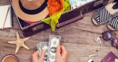 Counting money while packing for a cruise