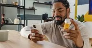 Man ordering prescription on phone