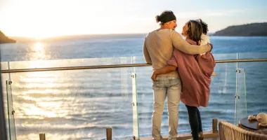 This couple with child on ship deck could use tips from our cruise safety guide