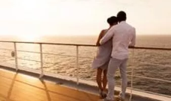 Man and woman on deck of cruise ship