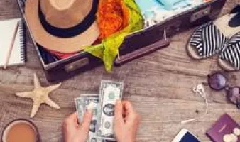 Counting money while packing for a cruise