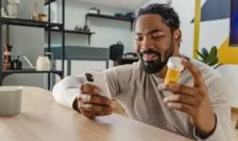 Man ordering prescription on phone
