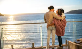This couple with child on ship deck could use tips from our cruise safety guide