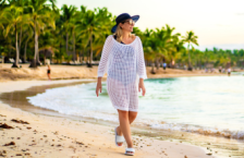 Woman walking on the beach during Caribbean travel.