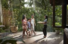 Family getting welcome drinks at a resort after deciding all-inclusives are worth it