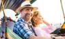 Middle-aged man and his companion handsome blond lady on a boat ride in Bangkok